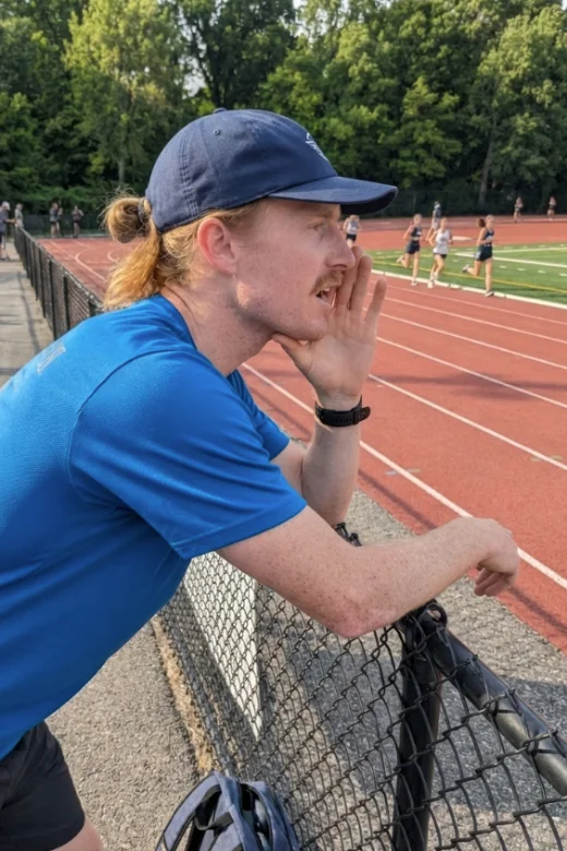 Coach Johnny Crain coaching at the track