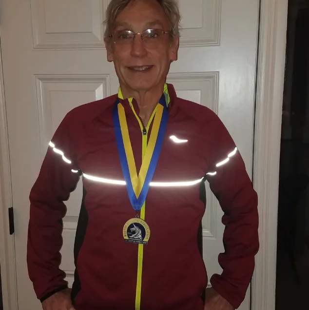 Myles with a marathon finisher medal